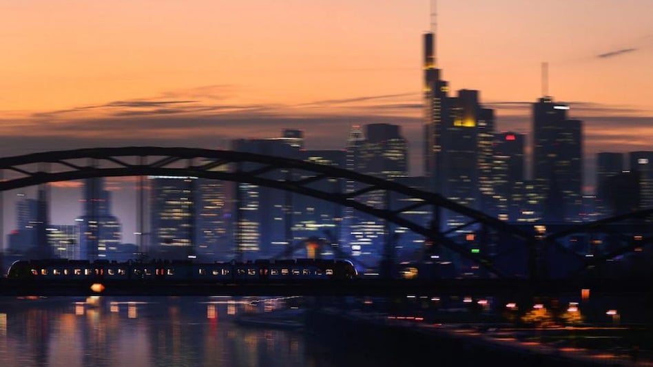 A commuter train passes by the skyline with its financial district ahead of the European Central Bank's governing council meeting later this week in Frankfurt, Germany. Photo: Reuters A commuter train passes by the skyline with its financial district ahead of the European Central Bank's governing council meeting later this week in Frankfurt, Germany. Photo: Reuters