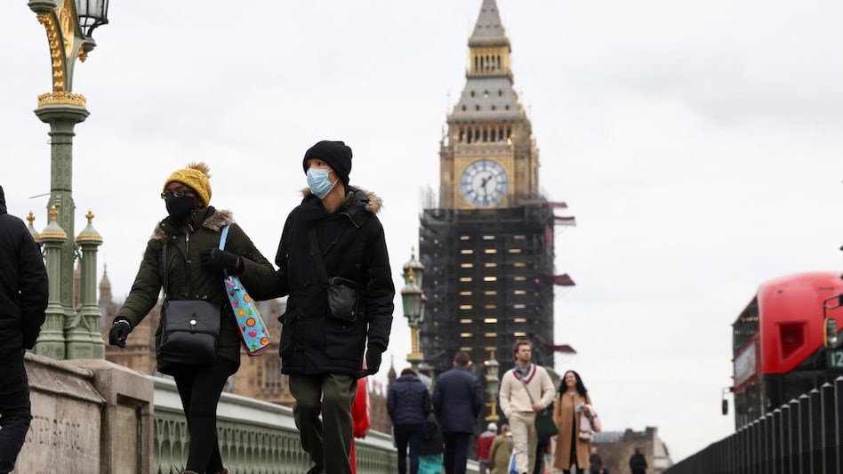 With a new highly transmissible Omicron variant of the virus surging across Britain, Prime Minister Boris Johnson has warned of a "tidal wave" of infections. With a new highly transmissible Omicron variant of the virus surging across Britain, Prime Minister Boris Johnson has warned of a "tidal wave" of infections.