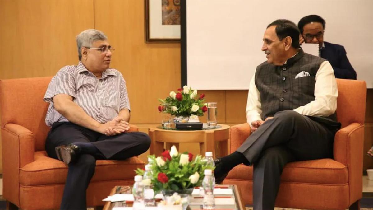 Nikhil Merchant (left) with former Gujarat CM Vijay Rupani. Photo: Twitter Nikhil Merchant (left) with former Gujarat CM Vijay Rupani. Photo: Twitter