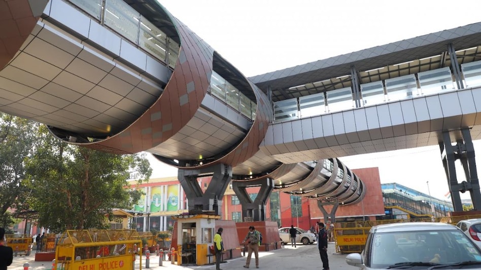 The beautifully designed skywalk has integrated escalator and stairs, reminiscent of Jantar Mantar, comprising Agra stone cladding, DMRC stated. (Photo: DMRC Twitter) The beautifully designed skywalk has integrated escalator and stairs, reminiscent of Jantar Mantar, comprising Agra stone cladding, DMRC stated. (Photo: DMRC Twitter)