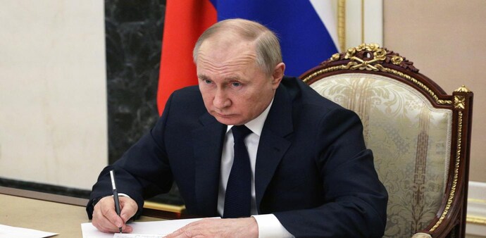 Russian President Vladimir Putin attends a meeting with government members via a video link in Moscow Russian President Vladimir Putin attends a meeting with government members via a video link in Moscow