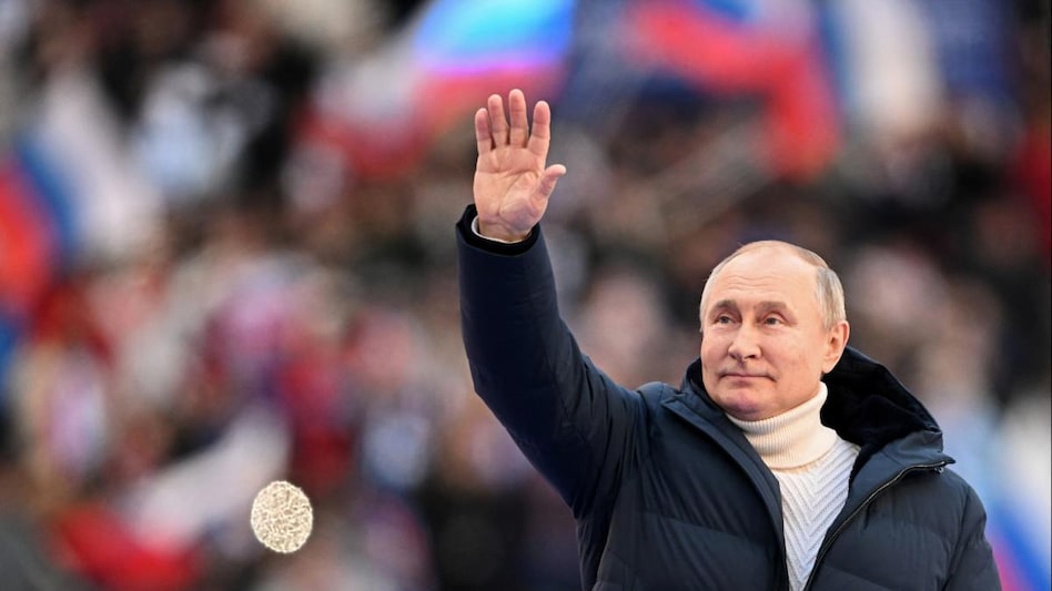 Russian President Vladimir Putin attends a concert marking the eighth anniversary of Russia's annexation of Crimea in Moscow. Russian President Vladimir Putin attends a concert marking the eighth anniversary of Russia's annexation of Crimea in Moscow.
