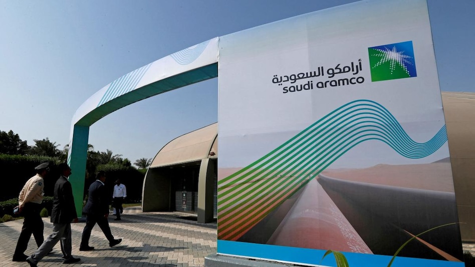 Logo of Aramco is seen as security personnel walk before the start of a press conference by Aramco. (Photo: Reuters) Logo of Aramco is seen as security personnel walk before the start of a press conference by Aramco. (Photo: Reuters)