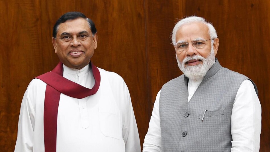 Prime Minister Narendra Modi (right) with Sri Lankan Finance Minister Basil Rajapaksa (left). Prime Minister Narendra Modi (right) with Sri Lankan Finance Minister Basil Rajapaksa (left).
