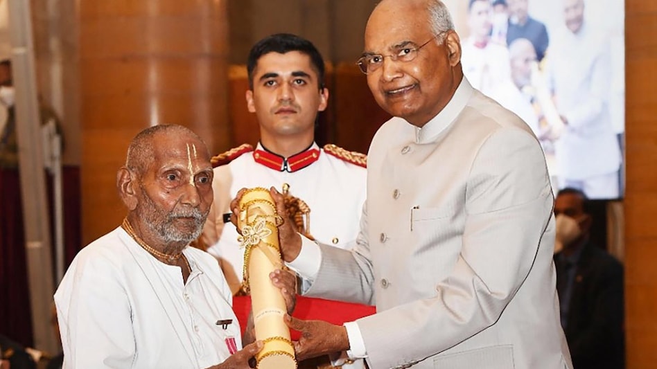 Swami Sivananda, dressed in white kurta and dhoti, received the Padma award for his contribution in the field of Yoga. (Photo: PTI) Swami Sivananda, dressed in white kurta and dhoti, received the Padma award for his contribution in the field of Yoga. (Photo: PTI)