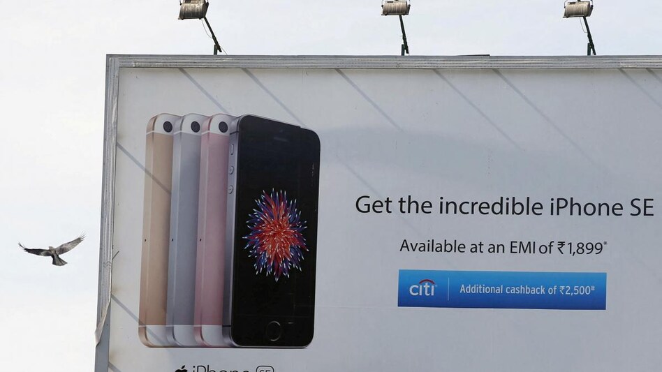 A bird flies past an Apple iPhone SE advertisement billboard in Mumbai (Photo: Reuters) A bird flies past an Apple iPhone SE advertisement billboard in Mumbai (Photo: Reuters)