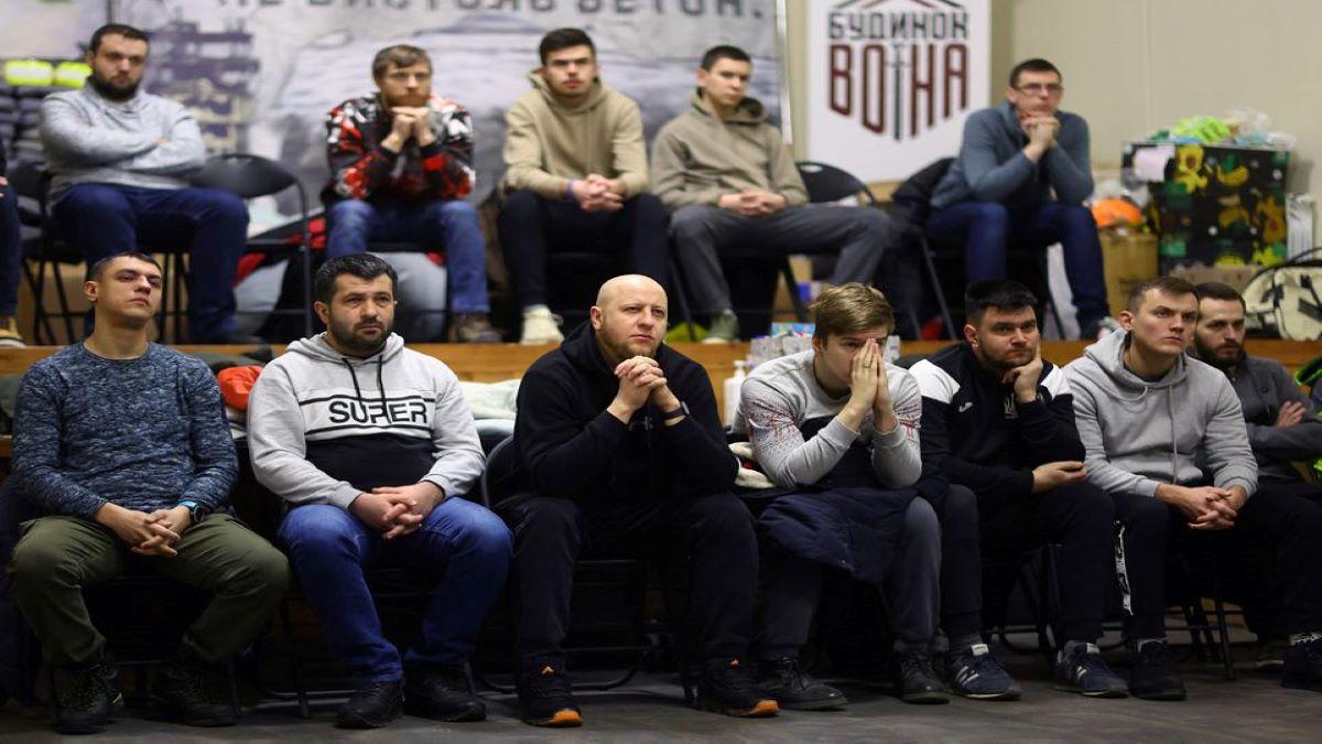 Volunteers for territorial defense listen to their instructor during their training in Lviv, Ukraine. (Reuters) Volunteers for territorial defense listen to their instructor during their training in Lviv, Ukraine. (Reuters)
