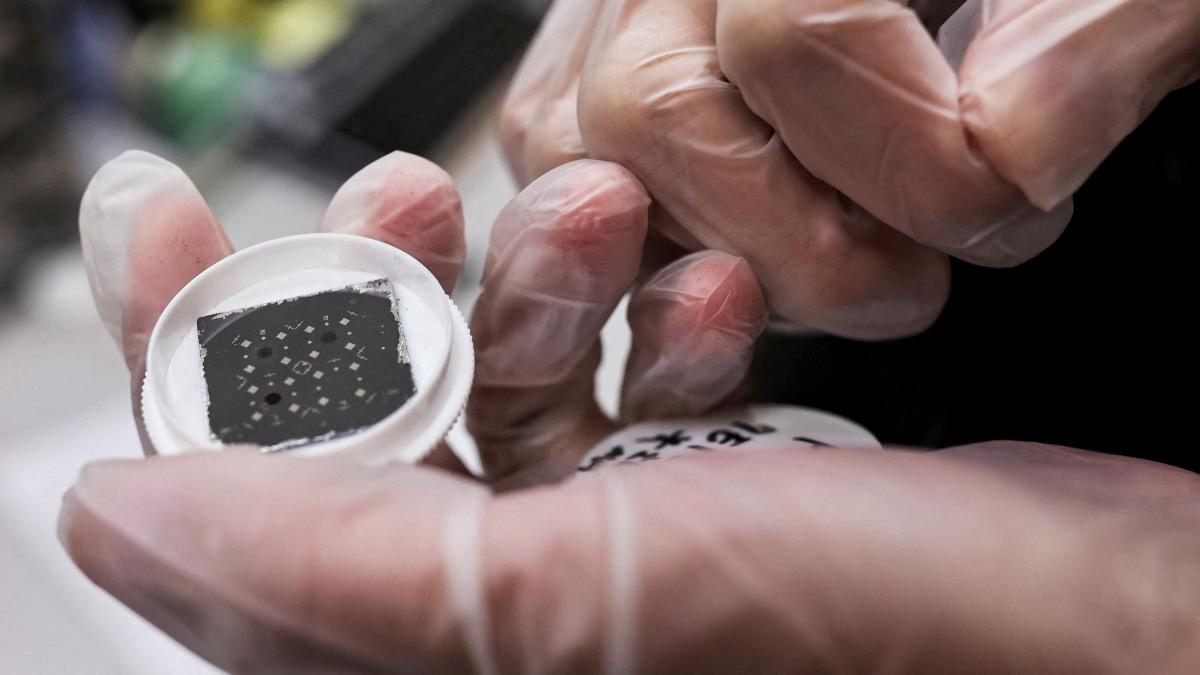 Representative image of an engineer holds a chip. (Photo: Reuters) 