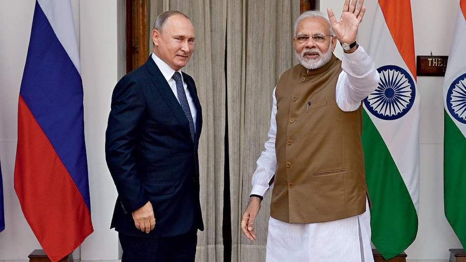 TALKING RATES? Russian President Vladimir Putin (left) and Indian Prime Minister Narendra Modi will have to agree to an exchange rate. (Photo: Pankaj Nangia) TALKING RATES? Russian President Vladimir Putin (left) and Indian Prime Minister Narendra Modi will have to agree to an exchange rate. (Photo: Pankaj Nangia)