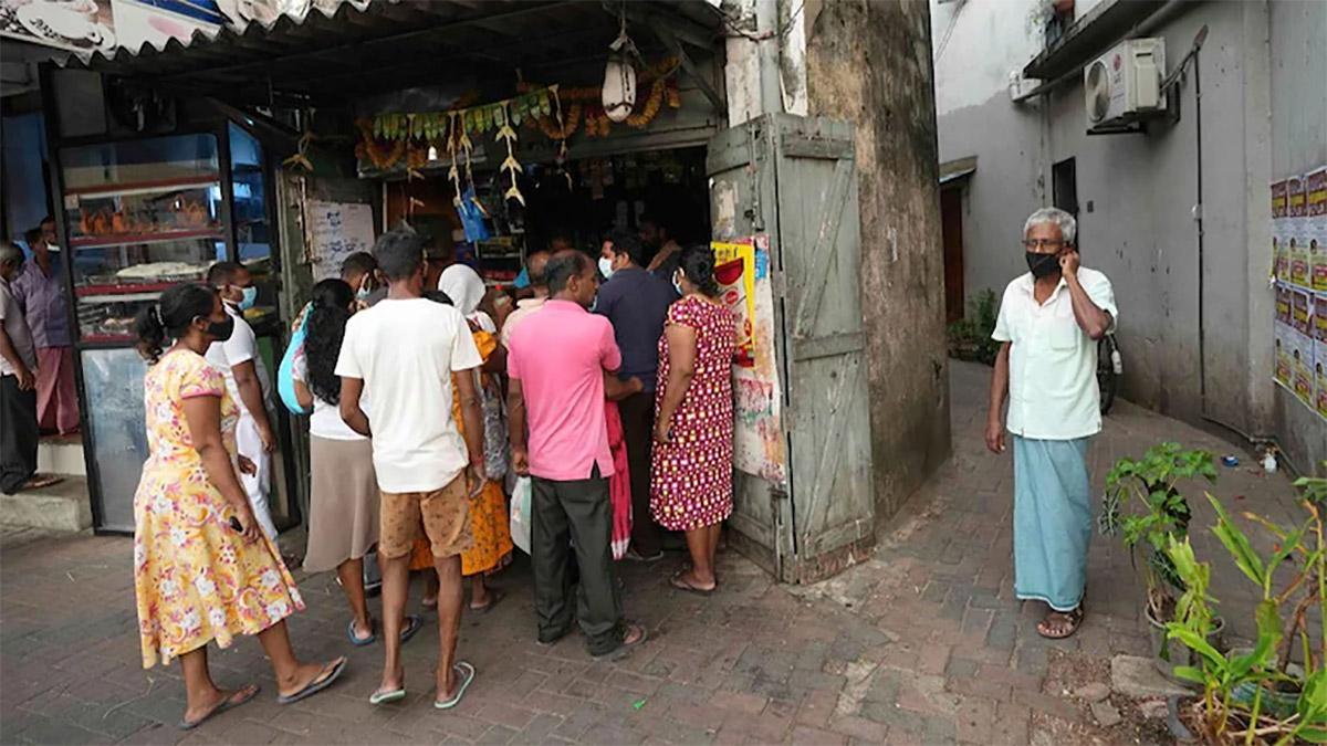 Sri Lankans crowd outside a grocery store in Colombo, Sri Lanka (PTI photo) Sri Lankans crowd outside a grocery store in Colombo, Sri Lanka (PTI photo)