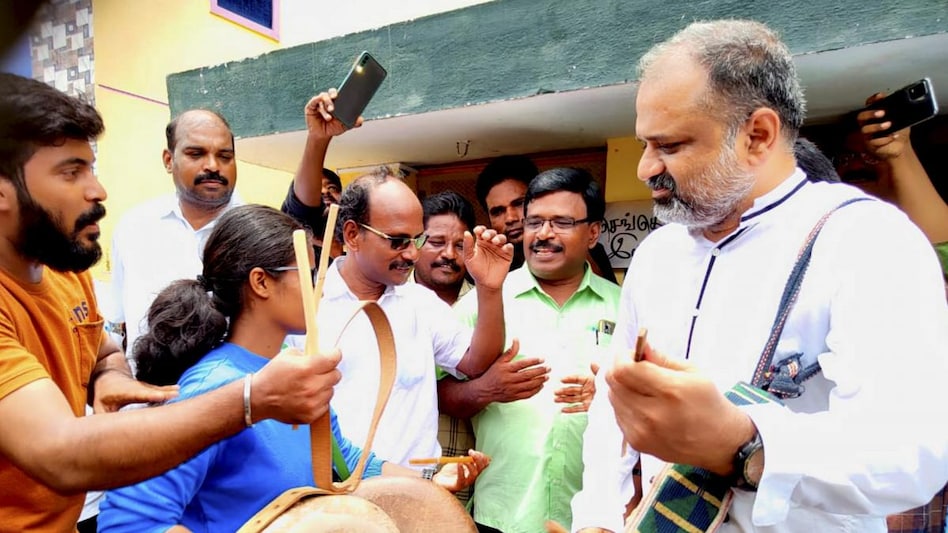 A.G. Perarivalan, a convict in the Rajiv Gandhi assassination case, plays a musical instrument to celebrate after Supreme Court released him using special powers, at his house in Jolarpet, Tirupattur A.G. Perarivalan, a convict in the Rajiv Gandhi assassination case, plays a musical instrument to celebrate after Supreme Court released him using special powers, at his house in Jolarpet, Tirupattur