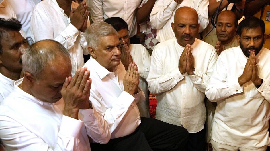 Sri Lanka's new prime minister Ranil Wickremesinghe (second left) Sri Lanka's new prime minister Ranil Wickremesinghe (second left)