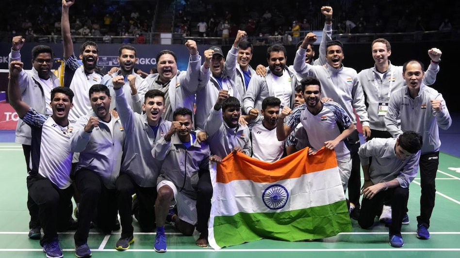 India's team members pose with their nation flag after winning Thomas Cup title in Bangkok India's team members pose with their nation flag after winning Thomas Cup title in Bangkok