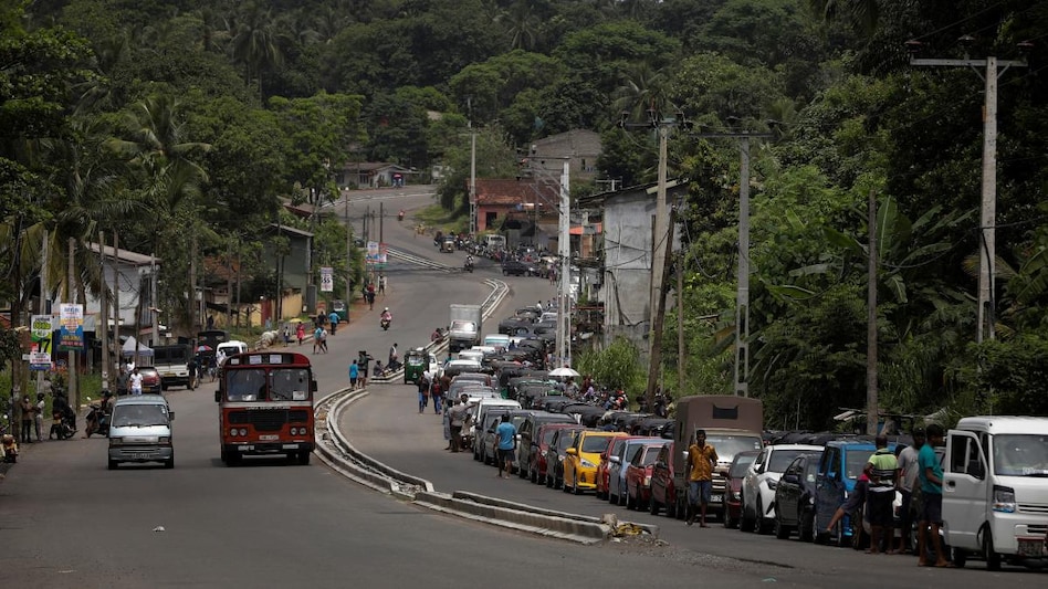 Vehicles queue to buy petrol at a fuel station in Gonapola town, on the outskirts of Colombo. Vehicles queue to buy petrol at a fuel station in Gonapola town, on the outskirts of Colombo.