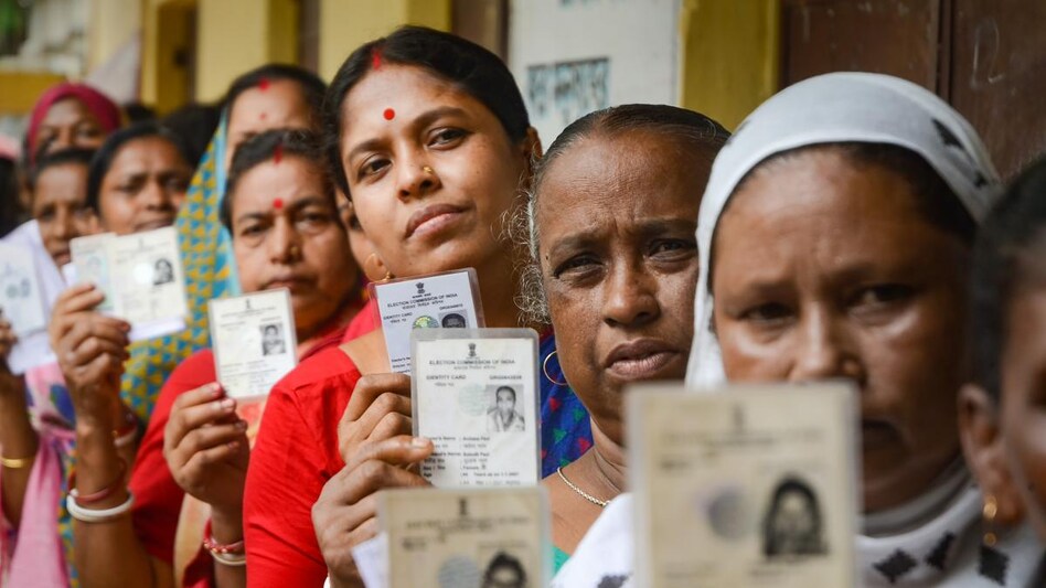 People wait in a queue at a polling station to cast their votes for Assembly by-elections, during in Agartala. (PTI Photo) People wait in a queue at a polling station to cast their votes for Assembly by-elections, during in Agartala. (PTI Photo)