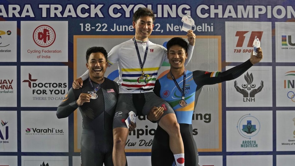Winners of Men Elite 1 kilometre Time Trial , gold medalists Japanese Yuta Obara, center, with silver medalist Malaysian Mohammad Zonis and Indian Ronaldo Singh Laitonjam Winners of Men Elite 1 kilometre Time Trial , gold medalists Japanese Yuta Obara, center, with silver medalist Malaysian Mohammad Zonis and Indian Ronaldo Singh Laitonjam