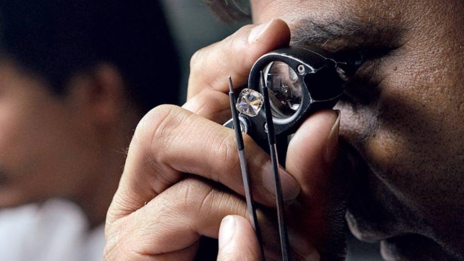 The US, where 70 per cent of the cut and polished diamonds are exported from India, has imposed a ban on Russian companies. The US, where 70 per cent of the cut and polished diamonds are exported from India, has imposed a ban on Russian companies.