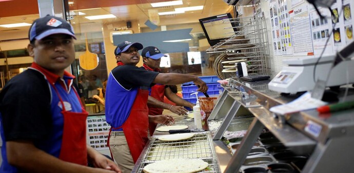 FILE PHOTO: Workers prepare pizzas in the kitchen of Domino's Pizza in New Delhi. (Photo: Reuters) FILE PHOTO: Workers prepare pizzas in the kitchen of Domino's Pizza in New Delhi. (Photo: Reuters)