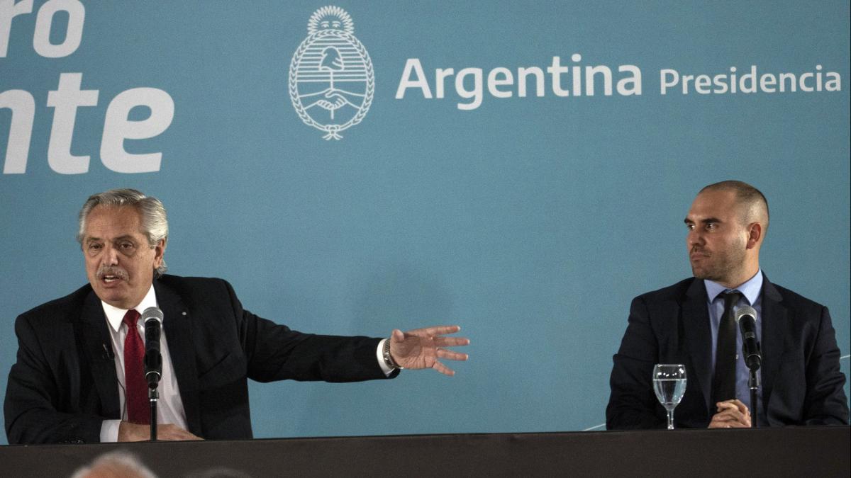 Argentina's President Alberto Fernandez, left, is accompanied by Economy Minister Martin Guzman Argentina's President Alberto Fernandez, left, is accompanied by Economy Minister Martin Guzman