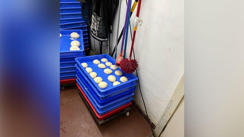 Domino's under fire for hanging mop over pizza dough Domino's under fire for hanging mop over pizza dough