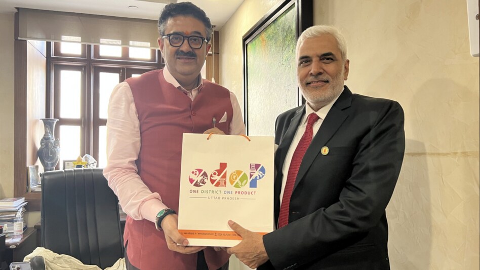 Navneet Sehgal (on the left) presenting ODOP gift to Ram Jass Yadav Navneet Sehgal (on the left) presenting ODOP gift to Ram Jass Yadav