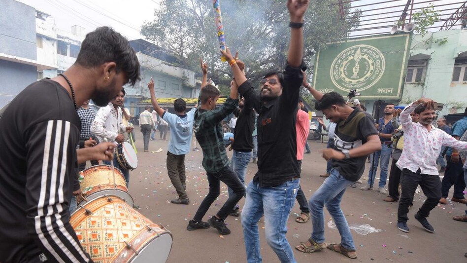 Municipal workers celebrate after Indore was declared as the cleanest city as per a government survey Municipal workers celebrate after Indore was declared as the cleanest city as per a government survey