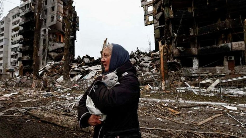 A woman carrying her cat amid destroyed buildings after Russia's invasion of Ukraine (Representative image: Reuters) A woman carrying her cat amid destroyed buildings after Russia's invasion of Ukraine (Representative image: Reuters)