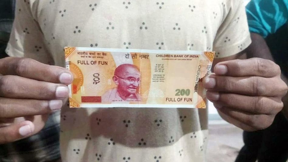 The news of the fake Rs 200 note spread like wildfire in the area, and a crowd gathered at the ATM. The news of the fake Rs 200 note spread like wildfire in the area, and a crowd gathered at the ATM.