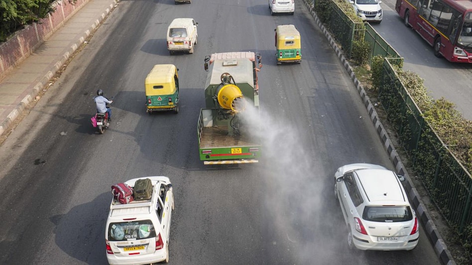 An anti-smog gun being used to spray water droplets to curb air pollution, in New Delhi. An anti-smog gun being used to spray water droplets to curb air pollution, in New Delhi.