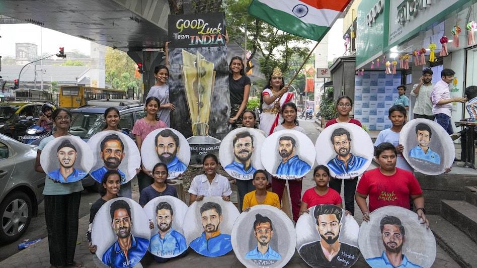 Art students show paintings made by them wishing good luck to team India for the ICC Men's T20 World Cup semi-final match, in Mumbai. Art students show paintings made by them wishing good luck to team India for the ICC Men's T20 World Cup semi-final match, in Mumbai.
