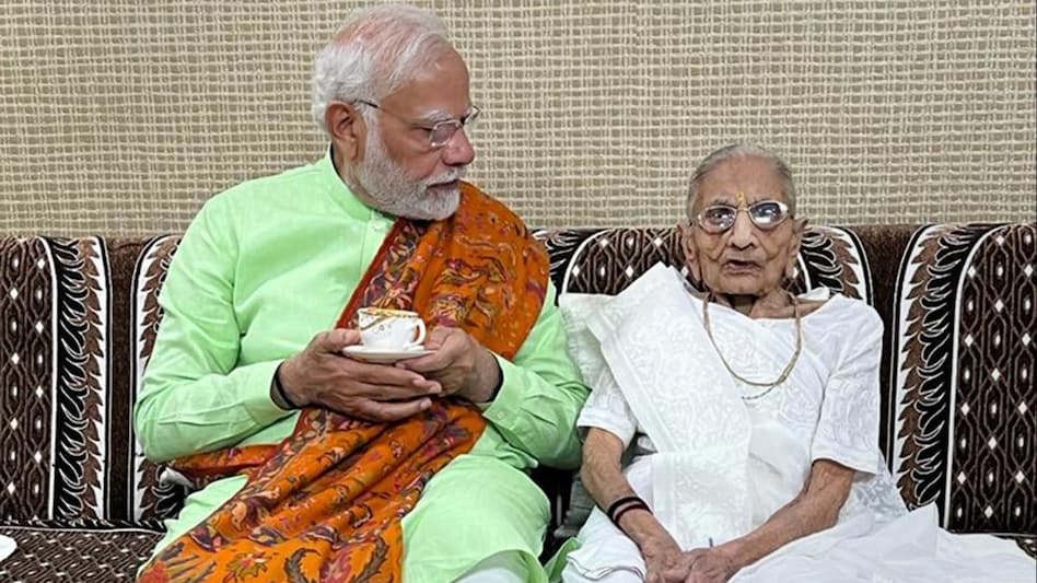 Prime Minister Narendra Modi meets his mother Hiraba at her residence on eve of second phase Gujarat Assembly elections. Prime Minister Narendra Modi meets his mother Hiraba at her residence on eve of second phase Gujarat Assembly elections.