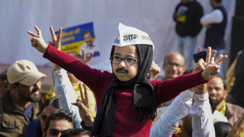 A child dressed up as Delhi CM Arvind Kejriwal takes part in the celebrations of AAP as the party crosses the majority mark in the MCD polls, in New Delhi. A child dressed up as Delhi CM Arvind Kejriwal takes part in the celebrations of AAP as the party crosses the majority mark in the MCD polls, in New Delhi.