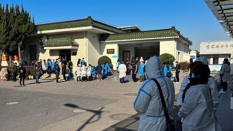 People wearing personal protective equipment stand outside a funeral home, as coronavirus disease outbreak continues, in Shanghai (Photo: Reuters) People wearing personal protective equipment stand outside a funeral home, as coronavirus disease outbreak continues, in Shanghai (Photo: Reuters)