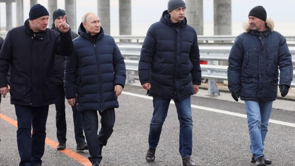 Putin also walked along parts of the bridge, Europe's largest, to inspect sections that are still visibly scorched. (Photo: Reuters) Putin also walked along parts of the bridge, Europe's largest, to inspect sections that are still visibly scorched. (Photo: Reuters)
