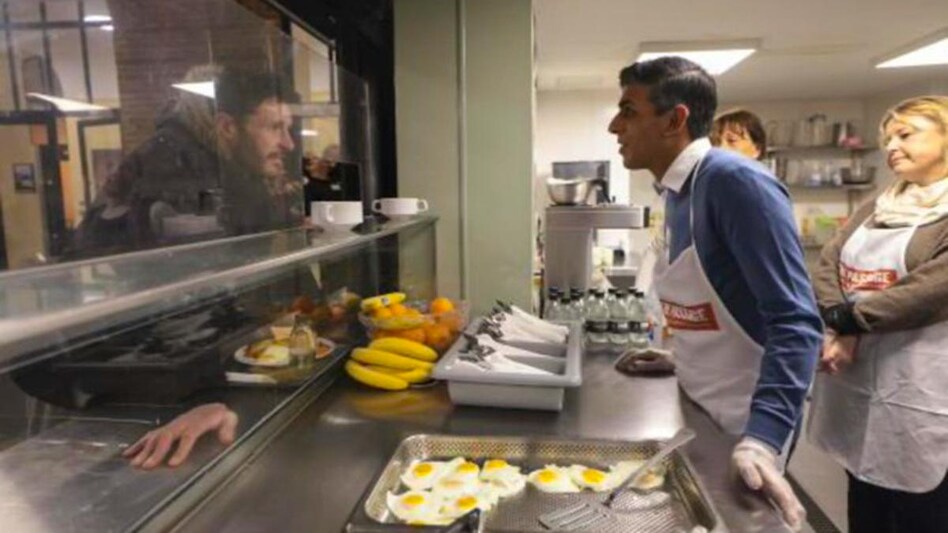 Rishi Sunak in conversation with a homeless man at a soup kitchen Rishi Sunak in conversation with a homeless man at a soup kitchen