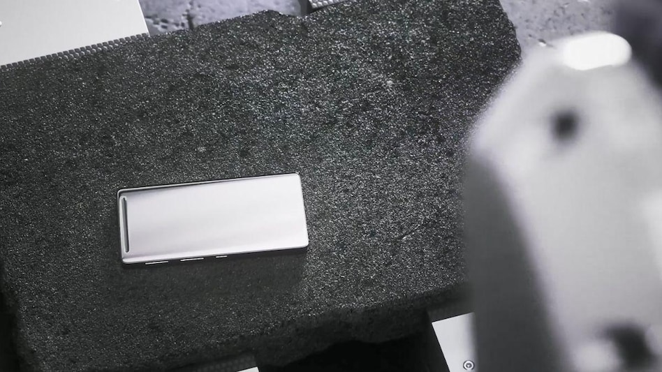 Smartphone with Corning Gorilla Glass Victus 2 being dropped on Asphalt to check durability Smartphone with Corning Gorilla Glass Victus 2 being dropped on Asphalt to check durability