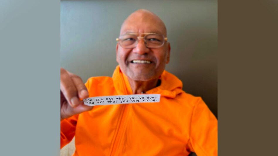 Vedanta's Anil Agarwal holds out a fortune cookie note Vedanta's Anil Agarwal holds out a fortune cookie note