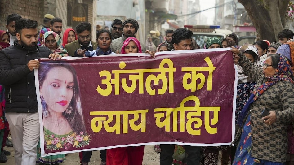 Family members along with locals protest demanding justice for the woman who was killed after being dragged by a car, at Karan Vihar area of Sultanpuri, in New Delhi (Photo: PTI) Family members along with locals protest demanding justice for the woman who was killed after being dragged by a car, at Karan Vihar area of Sultanpuri, in New Delhi (Photo: PTI)