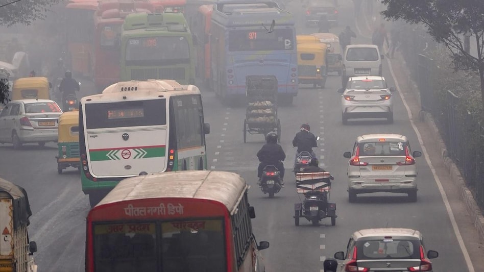 Vehicles ply on a road on a cold and foggy winter morning, in New Delhi (Photo: PTI) Vehicles ply on a road on a cold and foggy winter morning, in New Delhi (Photo: PTI)
