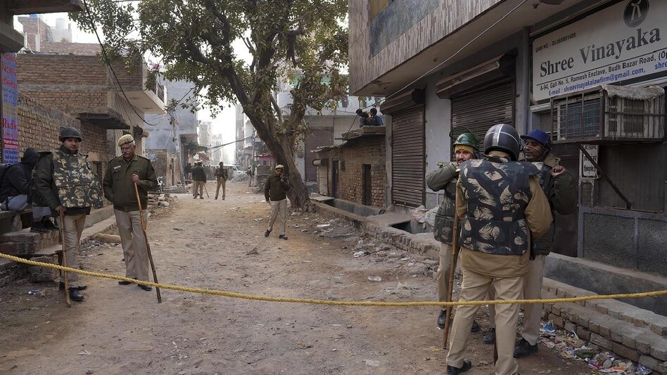 Delhi Police personnel deployed near the residence of the girl who was killed after being dragged by a car, at Karan Vihar area of Sultanpuri, in New Delhi Delhi Police personnel deployed near the residence of the girl who was killed after being dragged by a car, at Karan Vihar area of Sultanpuri, in New Delhi