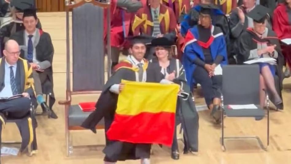 The video of him displaying the state flag on stage has gone viral. The video of him displaying the state flag on stage has gone viral.