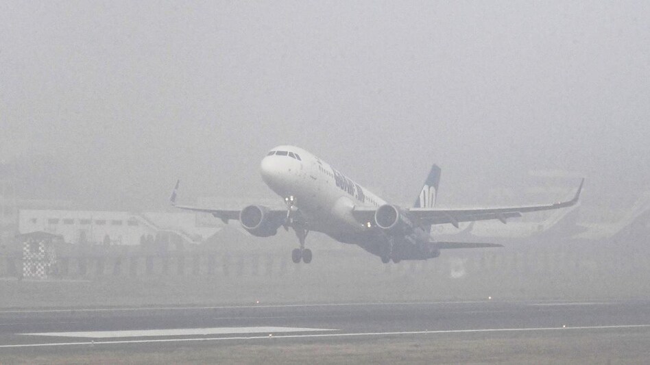 Several flights at the Delhi airport were delayed due to foggy conditions and low visibility Several flights at the Delhi airport were delayed due to foggy conditions and low visibility