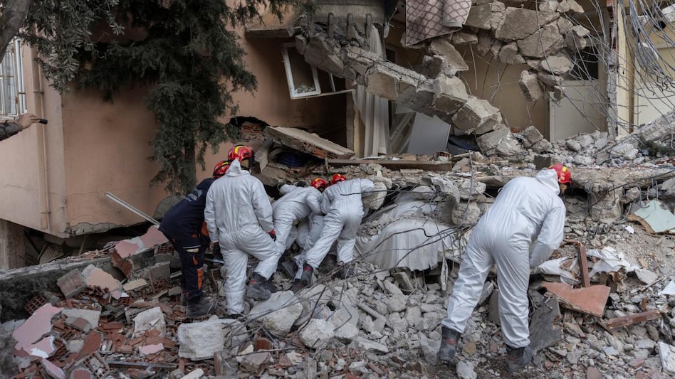 A search team look through the cracks in the rubble of a house as they look for missing persons in the aftermath of the deadly earthquake, in Hatay, Turkey A search team look through the cracks in the rubble of a house as they look for missing persons in the aftermath of the deadly earthquake, in Hatay, Turkey