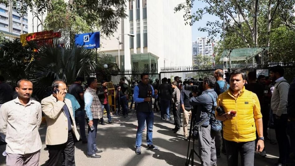 Members of media and people stand outside a building having BBC offices, where income tax officials are conducting a search, in New Delhi (Photo: Reuters) Members of media and people stand outside a building having BBC offices, where income tax officials are conducting a search, in New Delhi (Photo: Reuters)