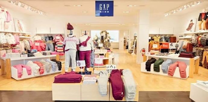 Gap's original emblem is easily recognisable: three bold letters positioned in an arc across the chest. Gap's original emblem is easily recognisable: three bold letters positioned in an arc across the chest.