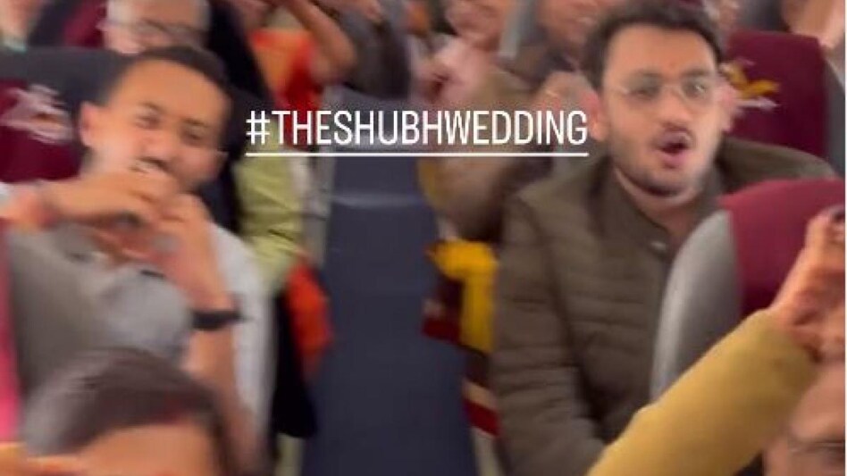 A video shows the bridegroom's family and friends clapping and creating heart A video shows the bridegroom's family and friends clapping and creating heart