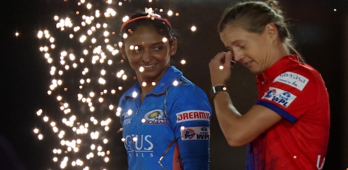 Women's Premier League Final - Mumbai Indians v Delhi Capitals- Brabourne Stadium, Mumbai, India - March 26, 2023. Mumbai Indians' capitan Harmanpreet Kaur and Delhi Capitals' captain Meg Lanning walk out before the game. Women's Premier League Final - Mumbai Indians v Delhi Capitals- Brabourne Stadium, Mumbai, India - March 26, 2023. Mumbai Indians' capitan Harmanpreet Kaur and Delhi Capitals' captain Meg Lanning walk out before the game.