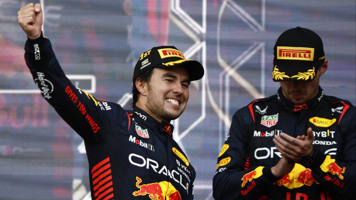 Red Bull's Sergio Perez celebrates on the podium after winning the race along with second placed Red Bull's Max Verstappen Red Bull's Sergio Perez celebrates on the podium after winning the race along with second placed Red Bull's Max Verstappen