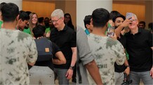 Apple fans touch CEO Tim Cook's feet at Delhi store, line up to get his autograph Apple fans touched Tim Cook's feet at the Saket store opening.