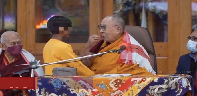 The Dalai Lama with the young boy The Dalai Lama with the young boy